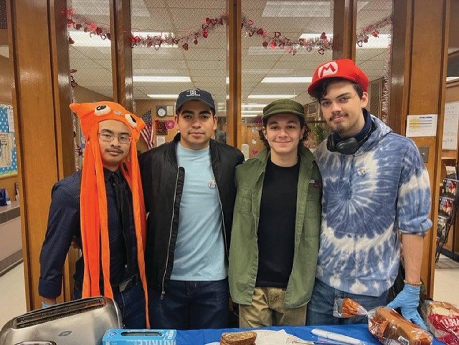 CRAZY CAPS: From left to right, Ricsa Soth, Joshua Galeas, Willson El Hage and Phoenix Russell pose for a photo on Crazy Hat Day.